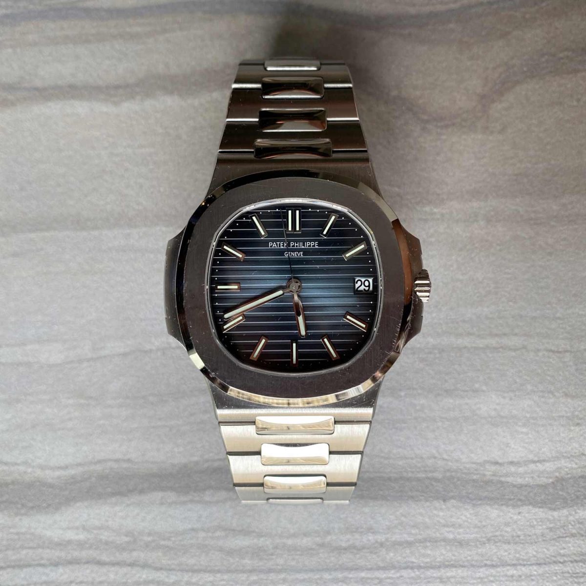 a photo of a silver watch known as the patek philippe nautilus 5711